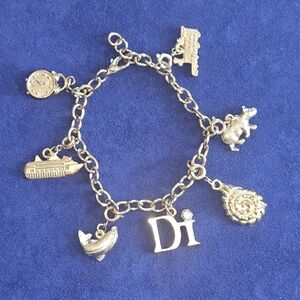 Diamonds International Goldtone Charm Bracelet 7 charms Travel Alaska Cruise